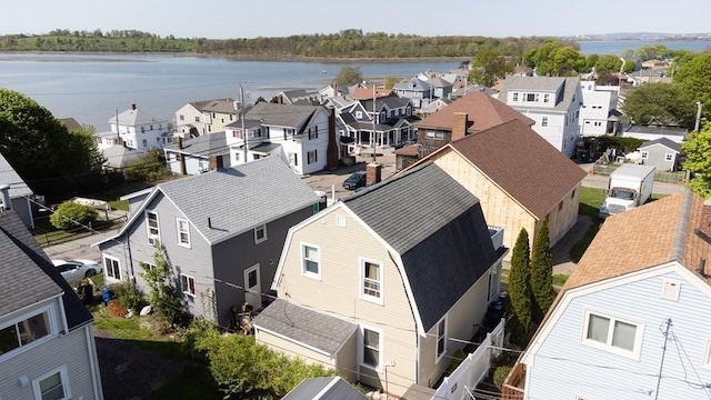 bird's eye view with a water view and a residential view