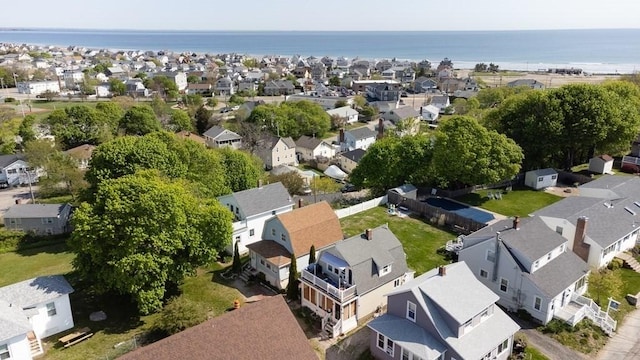 bird's eye view featuring a residential view and a water view