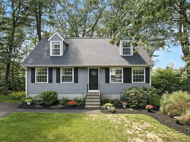 22 Dean St, Hudson, MA 01749 - cape cod house featuring a front lawn, entry steps, and roof with shingles