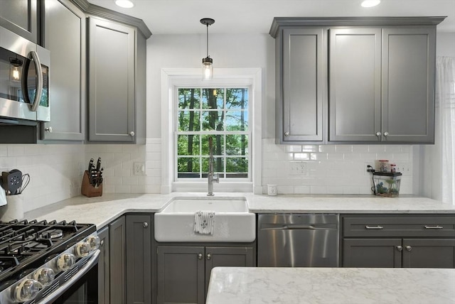 22 Dean St, Hudson, MA 01749 - kitchen with appliances with stainless steel finishes, gray cabinets, and tasteful backsplash