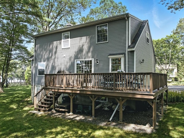 22 Dean St, Hudson, MA 01749 - rear view of property featuring a yard, a deck, and a chimney