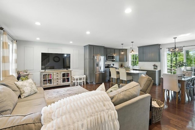 22 Dean St, Hudson, MA 01749 - living area with plenty of natural light, dark wood-style flooring, and recessed lighting