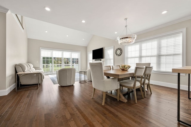 dining space featuring lofted ceiling, a chandelier, ornamental molding, and dark hardwood / wood-style flooring