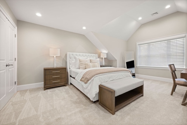 carpeted bedroom featuring lofted ceiling