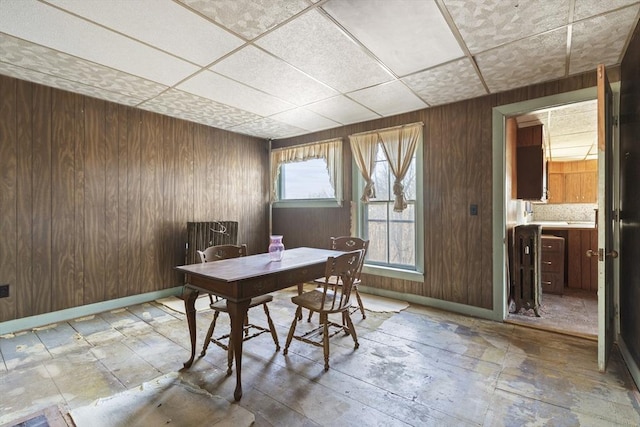 33 Burbank St, Millbury, MA 01527 - office area featuring wood walls, a drop ceiling, and baseboards