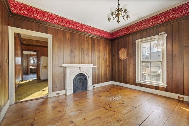 33 Burbank St, Millbury, MA 01527 - unfurnished living room with a chandelier, hardwood / wood-style flooring, a fireplace, and crown molding