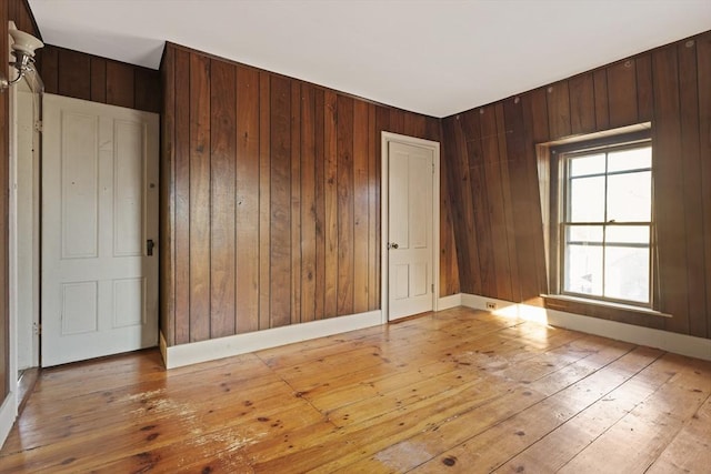 33 Burbank St, Millbury, MA 01527 - unfurnished room featuring light wood-style flooring and wood walls