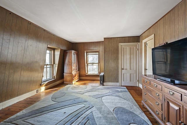 33 Burbank St, Millbury, MA 01527 - bedroom featuring dark wood-type flooring, wooden walls, and baseboards