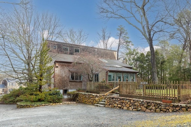 view of front of property featuring a fenced front yard and a chimney