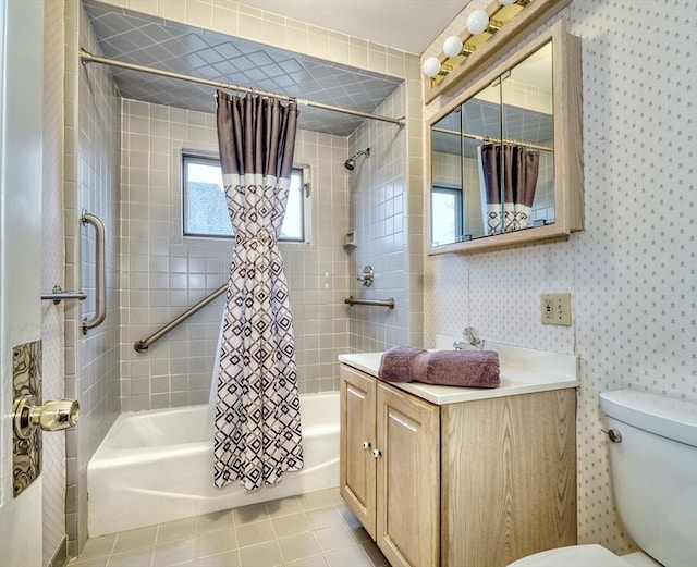 bathroom featuring shower / bath combination with curtain, toilet, vanity, tile patterned flooring, and wallpapered walls