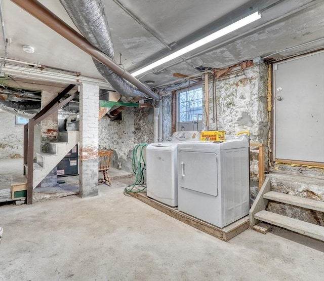 basement with stairs and independent washer and dryer