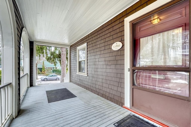 sunroom / solarium featuring wood ceiling