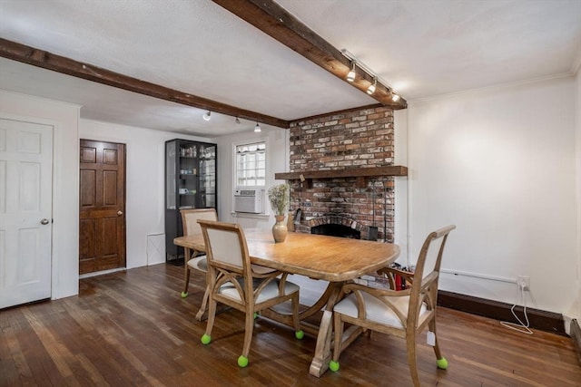 dining area featuring ornamental molding, beam ceiling, a fireplace, and dark wood finished floors