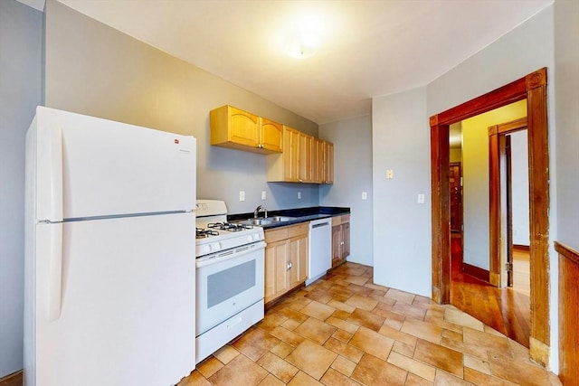 76 Belden St, Boston, MA 02125 - kitchen with white appliances, light brown cabinetry, a sink, light stone finish floors, and dark countertops