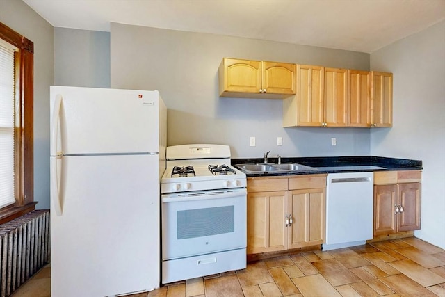 76 Belden St, Boston, MA 02125 - kitchen with white appliances, radiator heating unit, a sink, light brown cabinets, and dark countertops