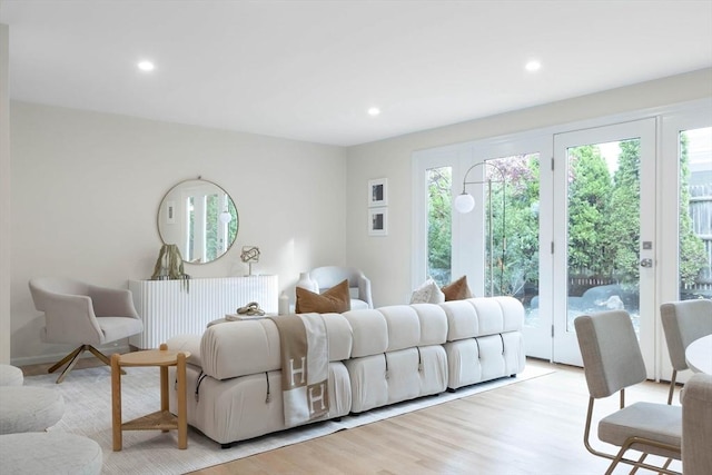 bedroom with light hardwood / wood-style floors and access to outside