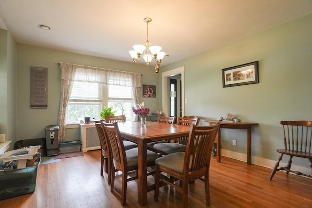 1013 Pleasant St, Worcester, MA 01602 - dining room featuring a chandelier and wood finished floors