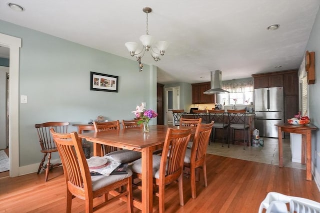 1013 Pleasant St, Worcester, MA 01602 - dining space with a chandelier and light wood-type flooring
