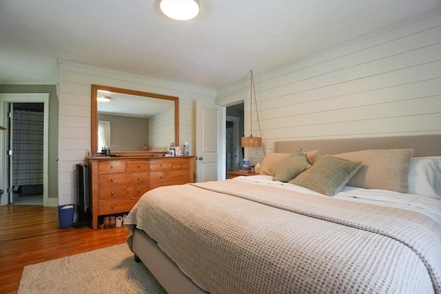 1013 Pleasant St, Worcester, MA 01602 - bedroom featuring wood finished floors and wood walls