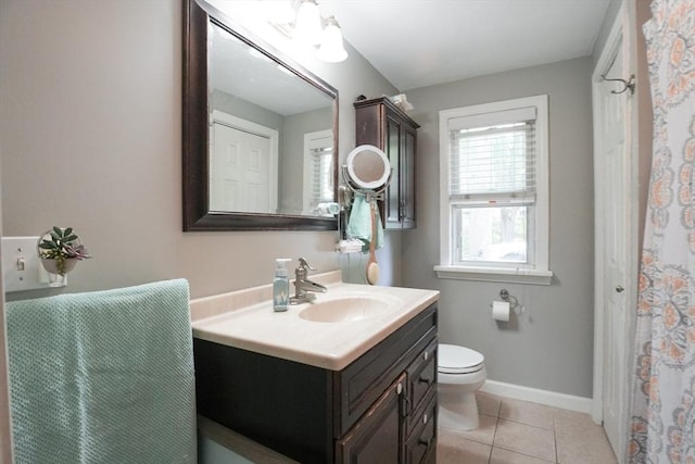 1013 Pleasant St, Worcester, MA 01602 - bathroom featuring vanity, toilet, tile patterned floors, and baseboards