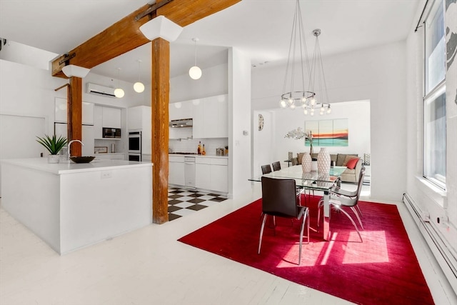 dining area featuring a wall mounted AC, a baseboard radiator, a notable chandelier, and a healthy amount of sunlight