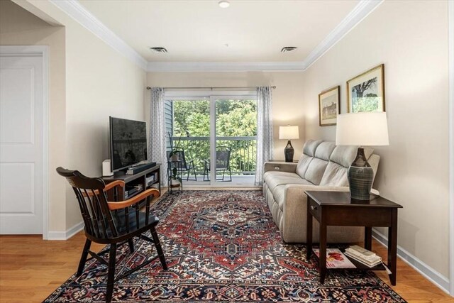 90 Trotter Rd Unit 309, Weymouth, MA 02190 - living room featuring ornamental molding and wood finished floors