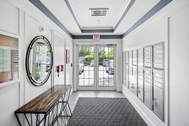 90 Trotter Rd Unit 309, Weymouth, MA 02190 - entryway featuring mail area, a tray ceiling, and light tile patterned floors