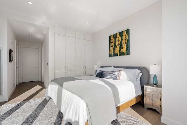 bedroom featuring a closet and light hardwood / wood-style flooring