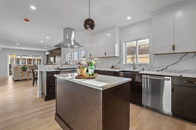 kitchen with a wealth of natural light, dishwasher, extractor fan, and decorative light fixtures