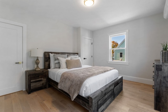 bedroom with light wood-type flooring