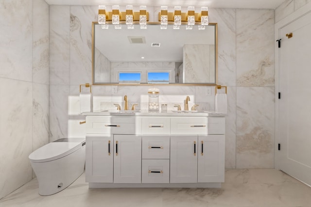 bathroom featuring vanity, toilet, and tile walls