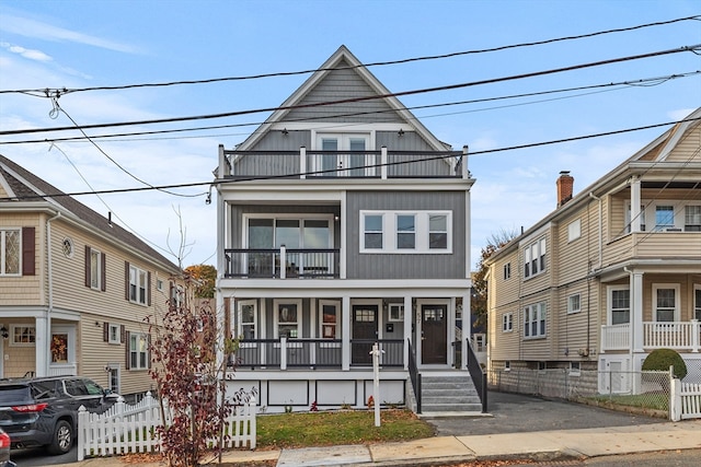 view of front facade with a porch and a balcony