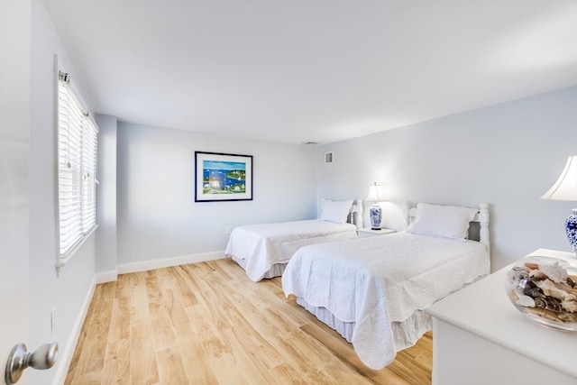 bedroom with light hardwood / wood-style floors