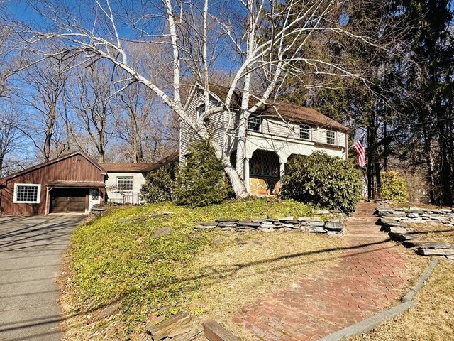 view of front of house with an outbuilding and an attached garage