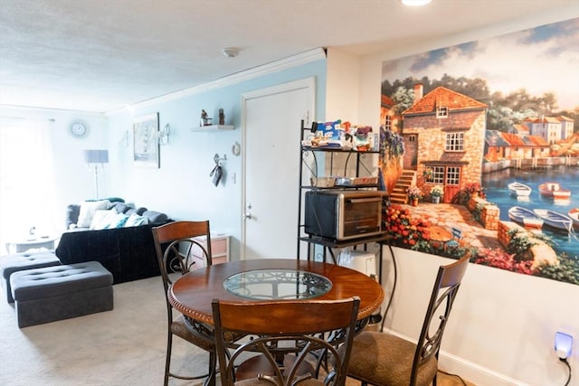 dining space with crown molding and carpet flooring