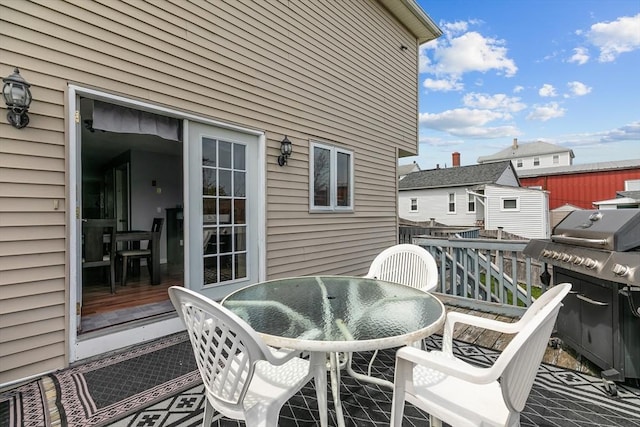 wooden deck with outdoor dining space