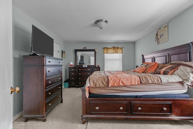 bedroom featuring light carpet
