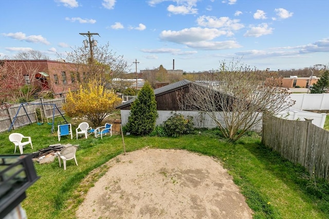 view of yard featuring a fire pit and a patio area