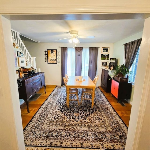 129 Lafayette St, Lowell, MA 01854 - dining room featuring ceiling fan, stairs, and wood finished floors