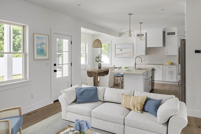 30 Franklin Ave, Oak Bluffs, MA 02557 - living area featuring healthy amount of natural light, dark wood-style floors, baseboards, and recessed lighting