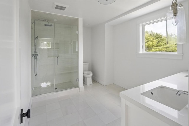 30 Franklin Ave, Oak Bluffs, MA 02557 - bathroom featuring a shower stall, double vanity, toilet, and baseboards
