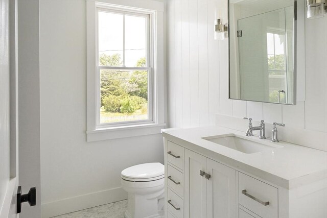 30 Franklin Ave, Oak Bluffs, MA 02557 - bathroom featuring vanity, toilet, and baseboards