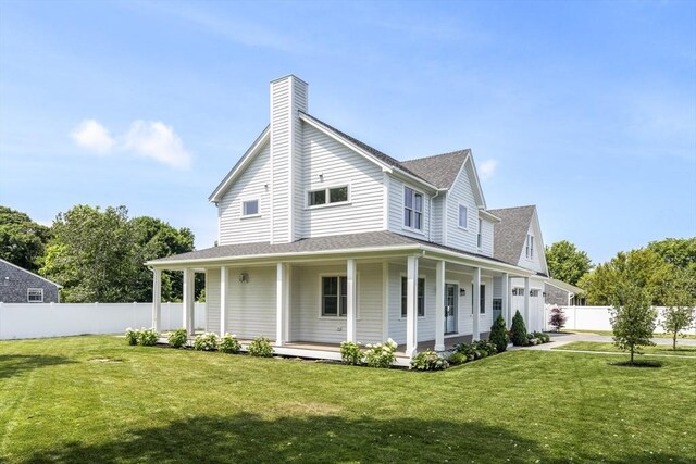 30 Franklin Ave, Oak Bluffs, MA 02557 - view of front of house with a porch, a chimney, roof with shingles, and a garage