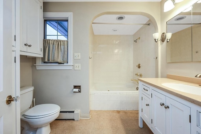 full bathroom featuring tiled shower / bath, vanity, a baseboard radiator, and toilet