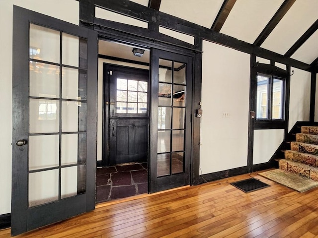 entryway with hardwood / wood-style floors