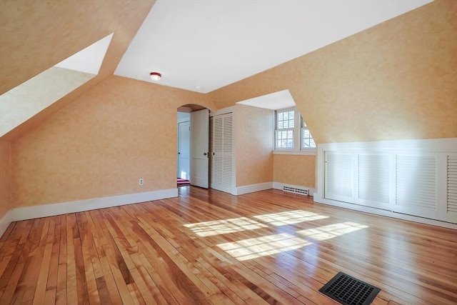 bonus room featuring light wood-type flooring