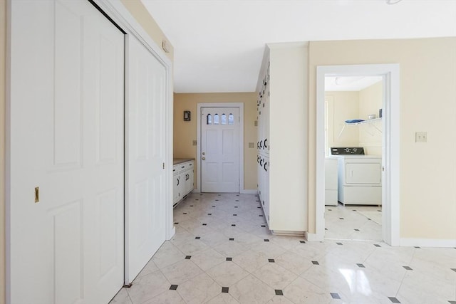 hallway with separate washer and dryer