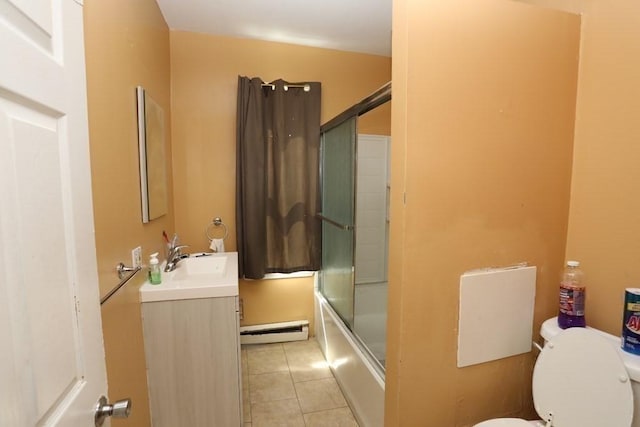 full bathroom featuring enclosed tub / shower combo, vanity, baseboard heating, toilet, and tile patterned floors