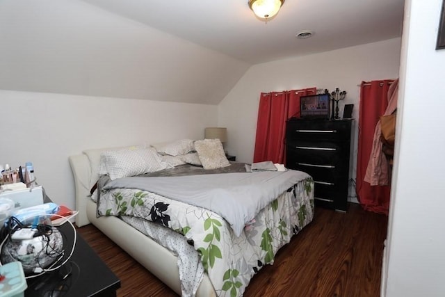 bedroom featuring dark hardwood / wood-style floors and vaulted ceiling