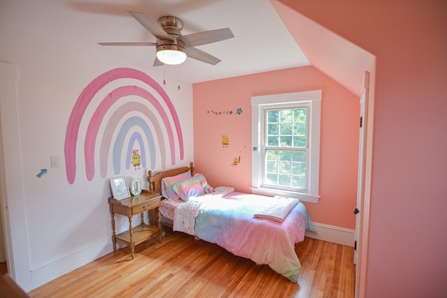 bedroom with lofted ceiling, light hardwood / wood-style flooring, and ceiling fan